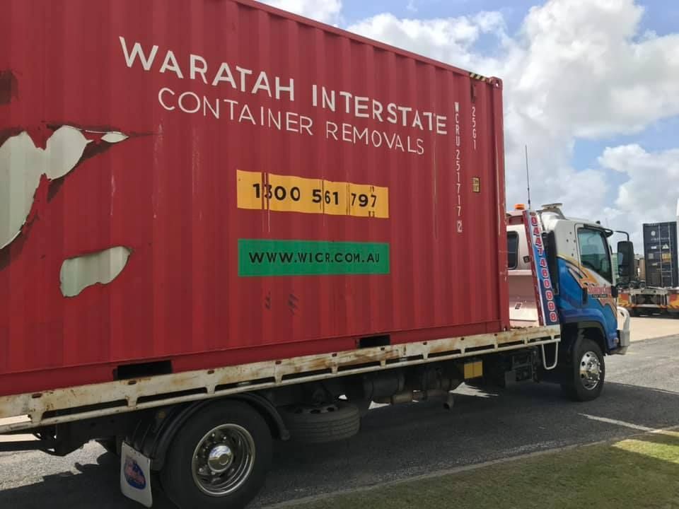 Tow Truck Carrying a Tan Pickup in a Sunny Suburban Driveway — Southern Cross Tilt Trays in Rockhampton, QLD