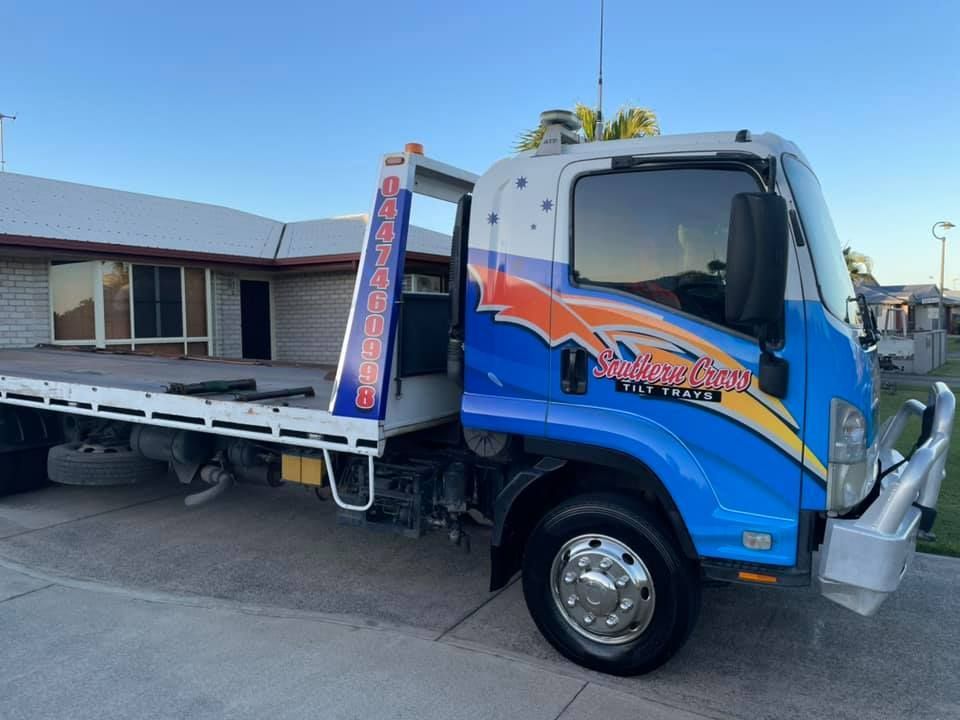 Blue Tow Truck Parked Outside a Building — Southern Cross Tilt Trays in Emerald, QLD