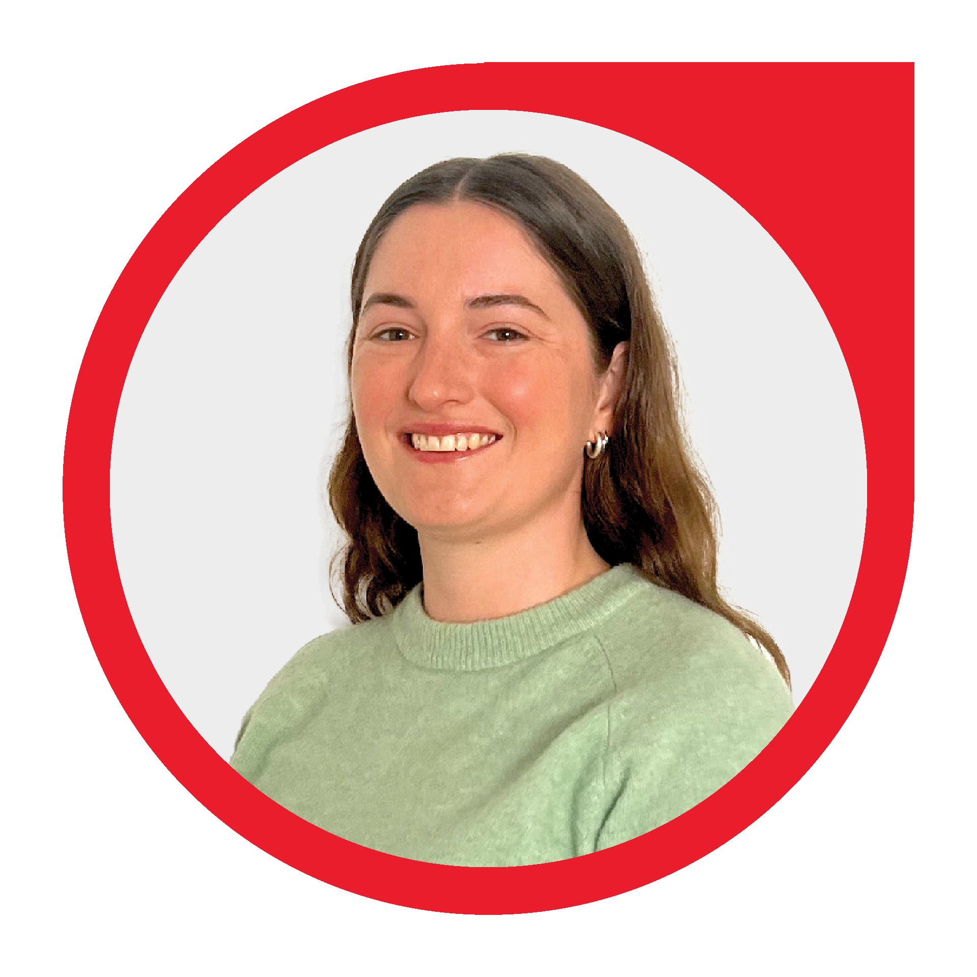 Woman with brown hair smiling, wearing a green sweater, inside a red and white circular logo.