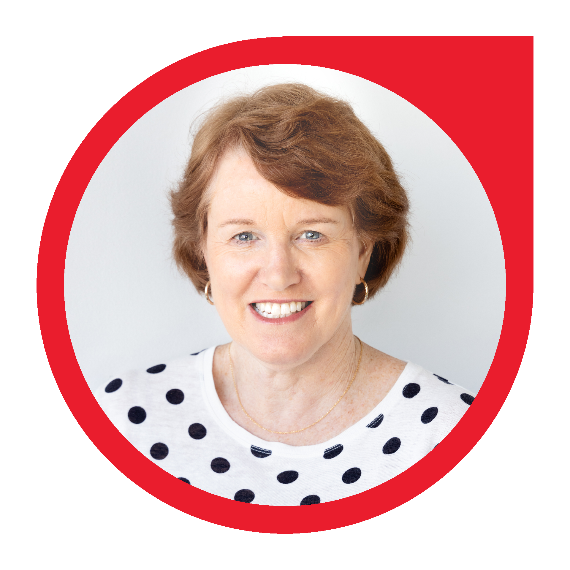 Woman with short brown hair, smiling, wearing a polka dot shirt, framed by a red circle.