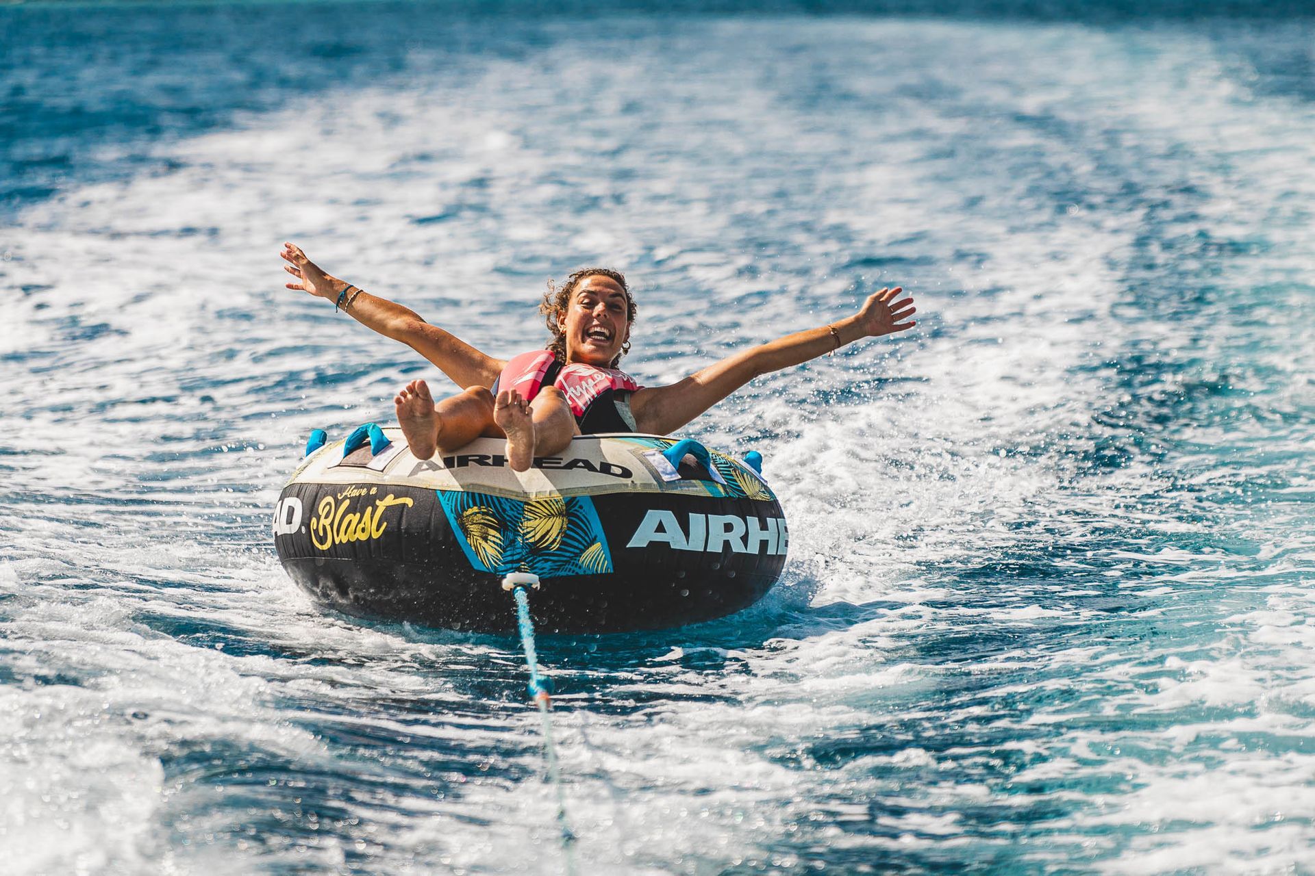 A young lady having fun with Tubing on Bonaire.