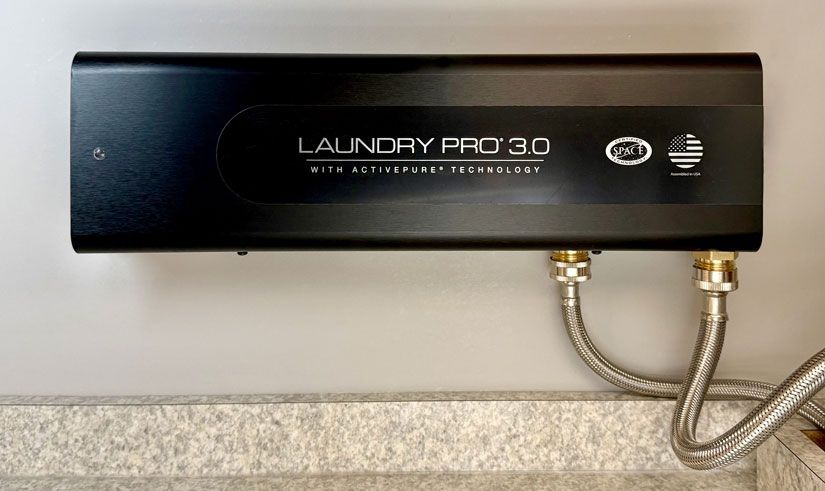 A digital thermostat mounted on a wall displays the current temperature as 72 degrees Fahrenheit.