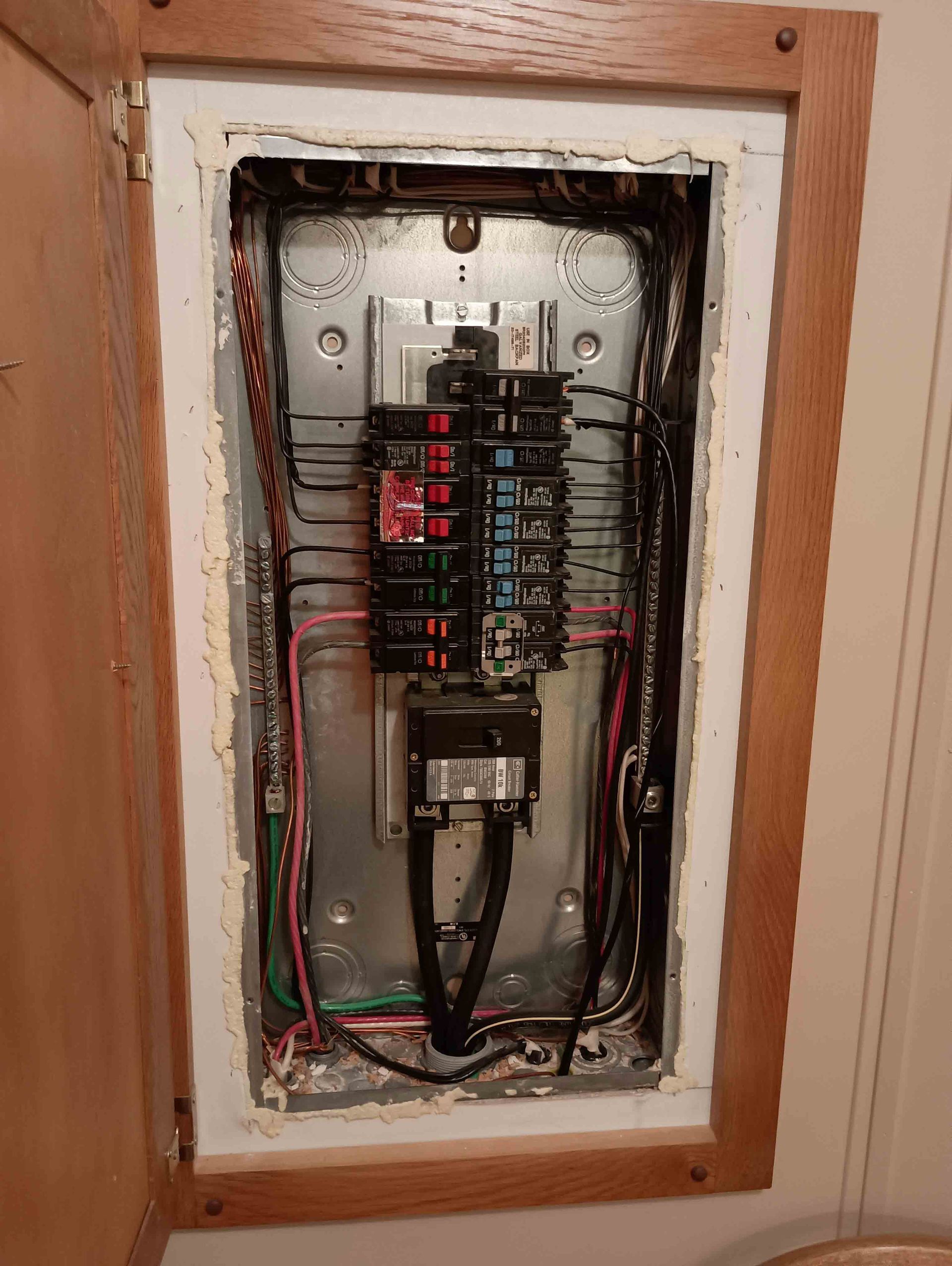 Electrical Box With A Lot Of Wires Coming Out Of It — Knoxville, TN — DABZ CO LLC Electrical & Building Contractors Electrical Box With A Lot Of Wires Coming Out Of It — Knoxville, TN — DABZ CO LLC Electrical & Building Contractors