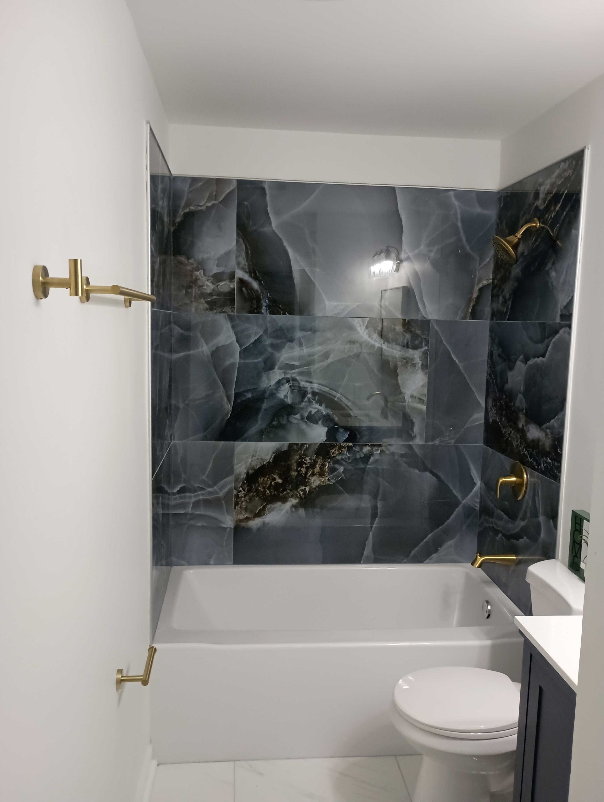 A Bathroom With A Bathtub , Toilet , Sink And Shower — Knoxville, TN — DABZ CO LLC Electrical & Building Contractors