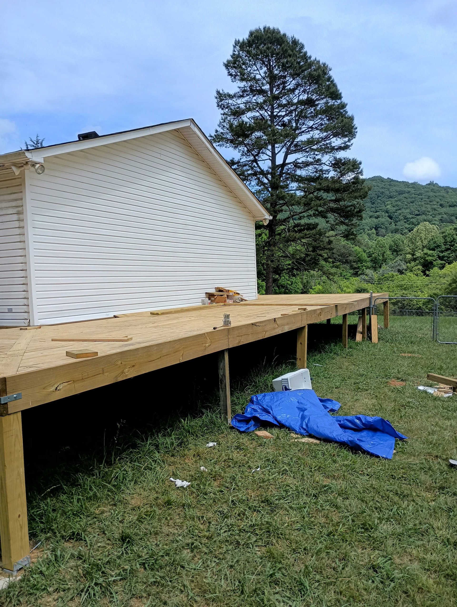 Wooden Deck Is Being Built In Front Of A House — Knoxville, TN — DABZ CO LLC Electrical & Building Contractors