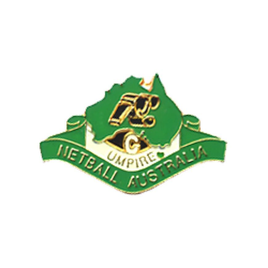 Green and gold Melbourne Australia netball umpire emblem with whistle and ribbon banner