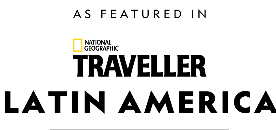 A national geographic logo that says `` as featured in traveller latin america ''.