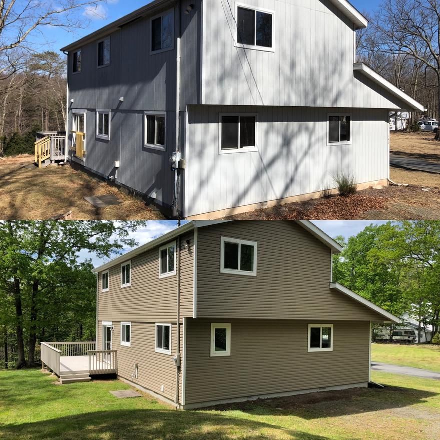 Two-story house with gray siding (top) and beige siding (bottom). Deck, windows, and trees in the setting.