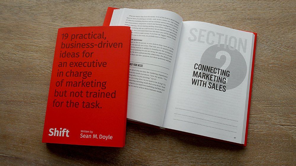 a book is open to a section titled connecting marketing with sales