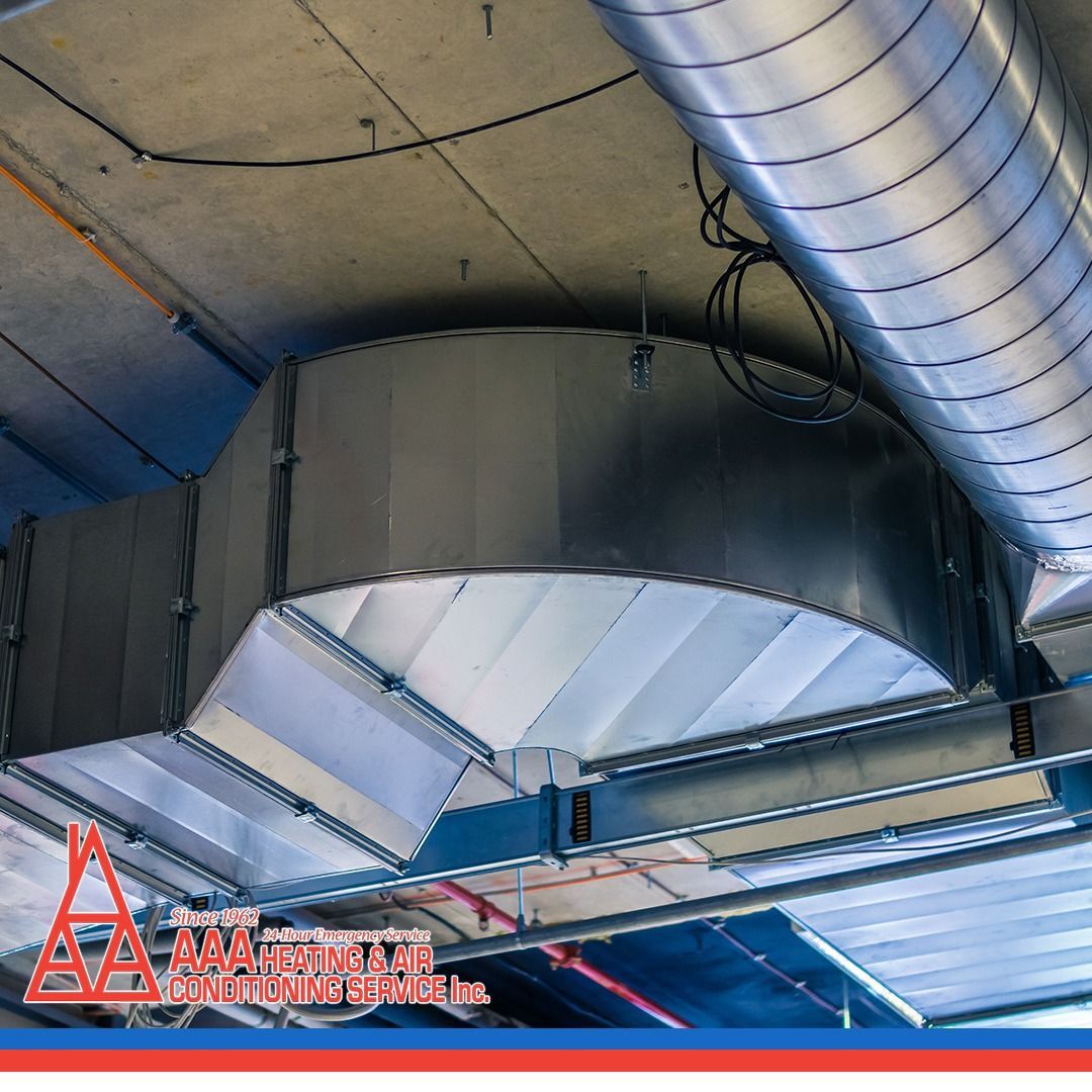 Metal HVAC ductwork installed on a ceiling.