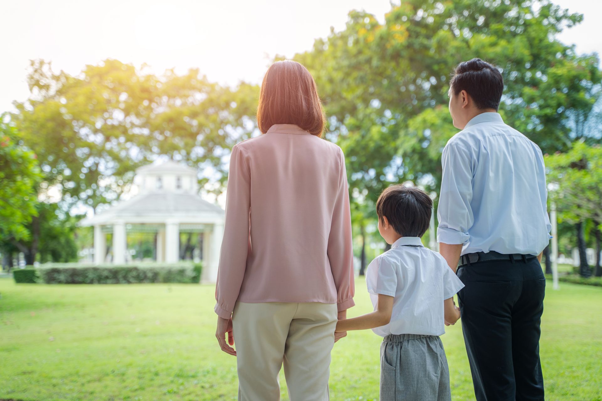 Family walking together in a park, the moments memorials are made to honor