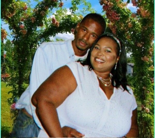 A man and a woman are posing for a picture