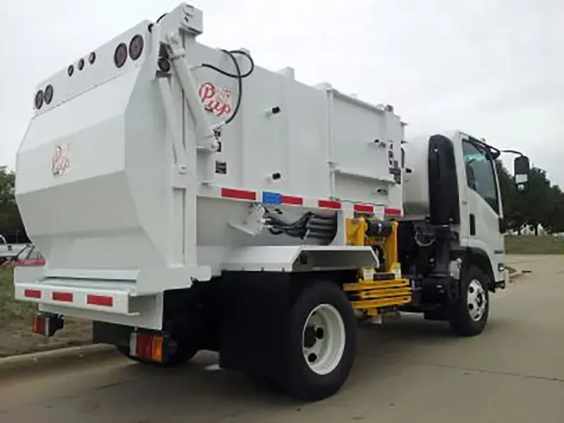 White garbage truck parked on a road, side view with rear loading hopper and black cab