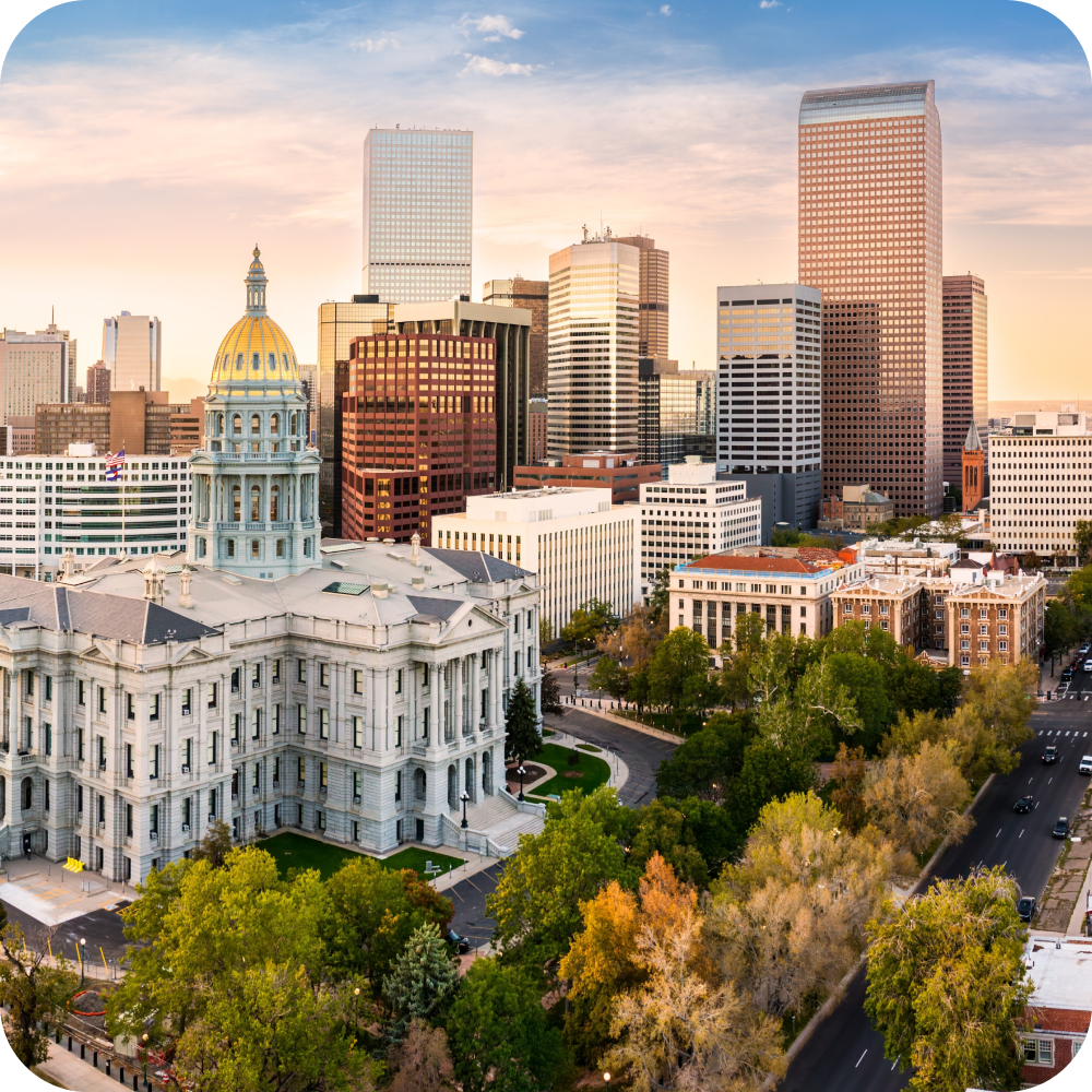 Colorado State Capitol and downtown Denver skyline at sunset
