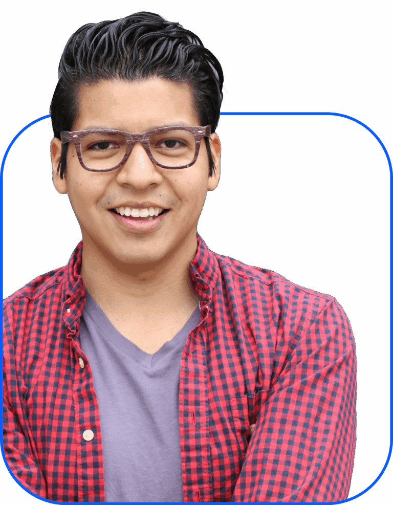 Smiling man in glasses wearing a red checkered shirt over a gray T-shirt, against a white background.