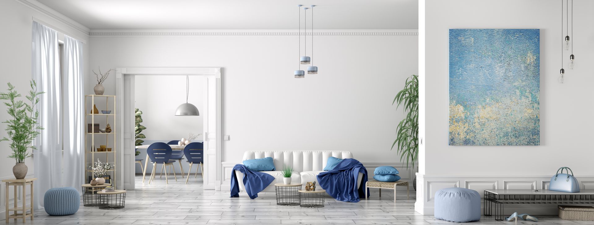 Bright white living room with blue accents, abstract wall art, and sofa by a dining area
