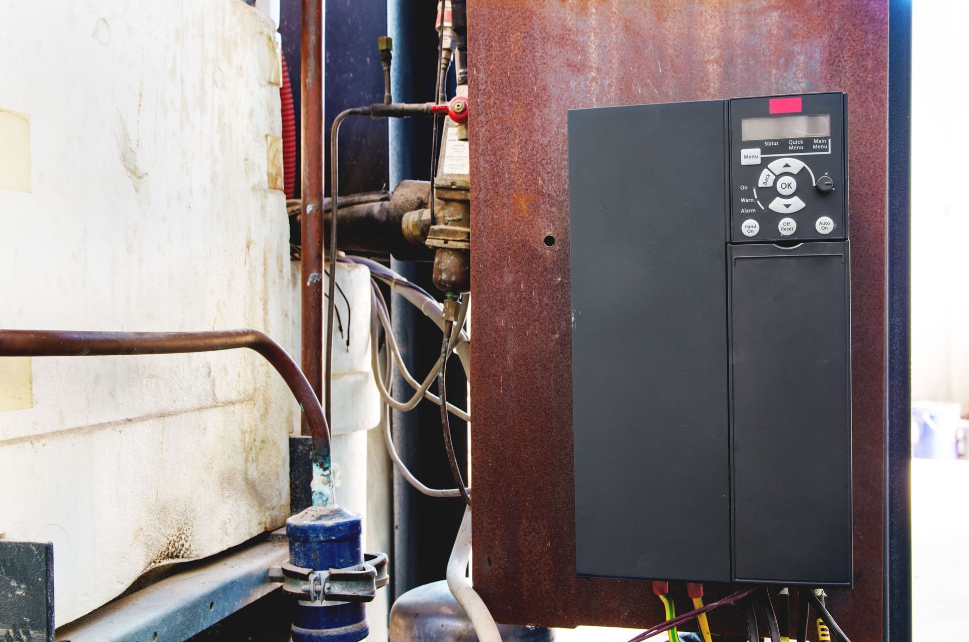 A close up of a inverter with a bunch of wires attached to it.