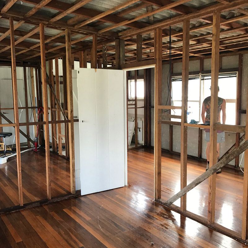 A Room with Wooden Walls and A White Door  — Northern Rivers Demolition & Asbestos in Grafton, NSW