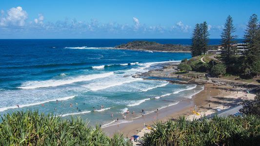 A Beach with Waves Crashing on The Shore on A Sunny Day — Northern Rivers Demolition & Asbestos in Yamba, NSW