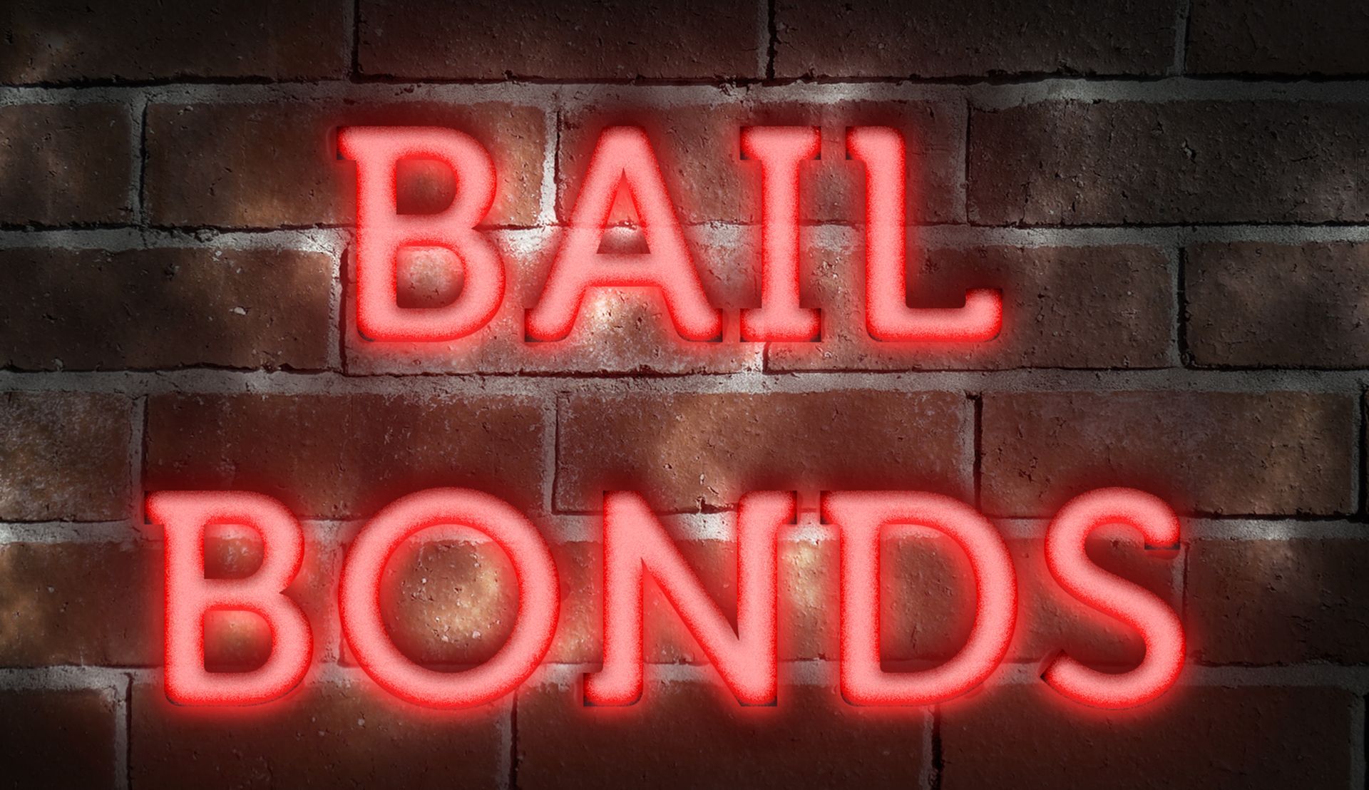 A red neon sign on a brick wall | bail bonds in Port St Joe Fl | Steele Boys' Bail Bonds 
