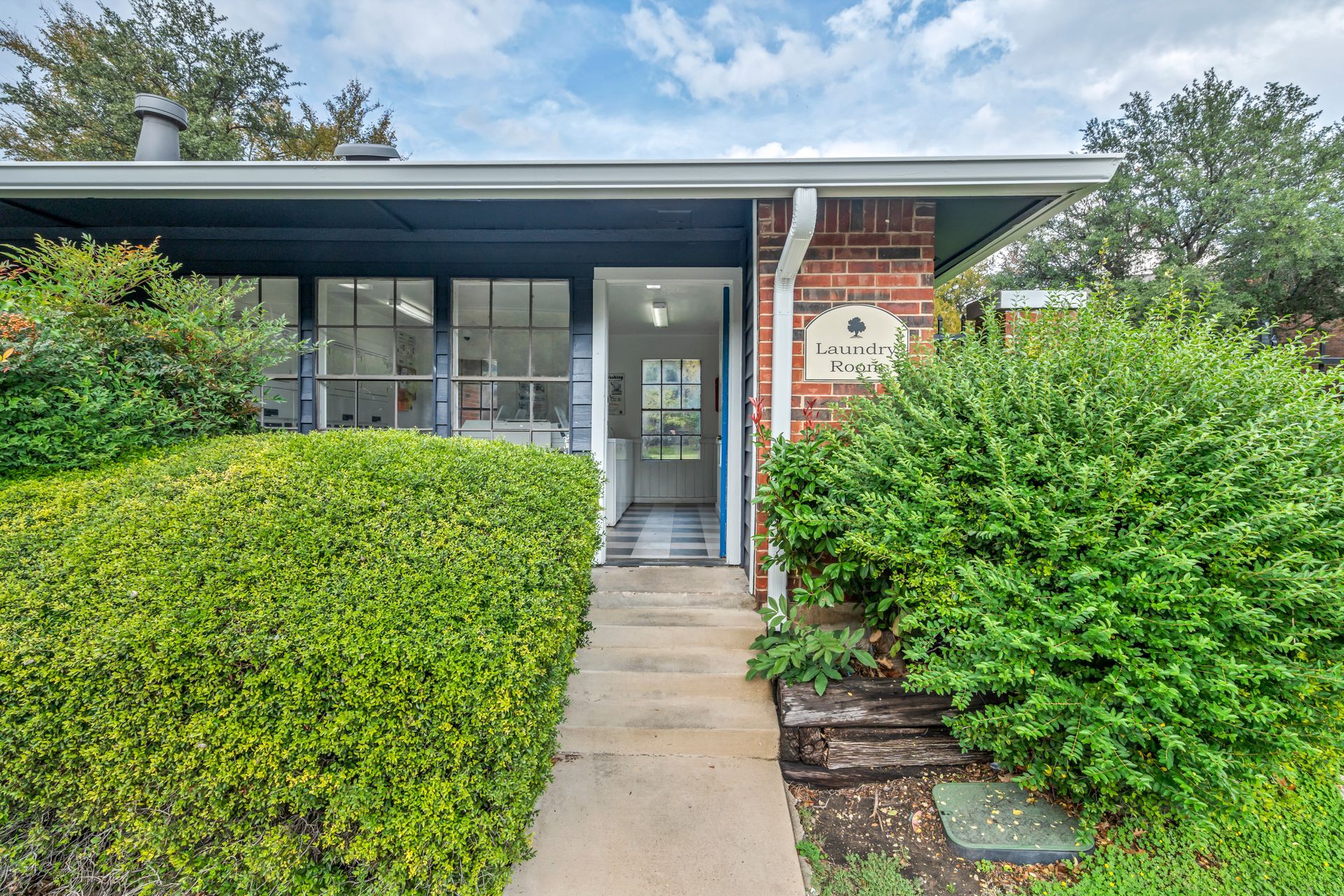 The front of a house with a walkway leading to it