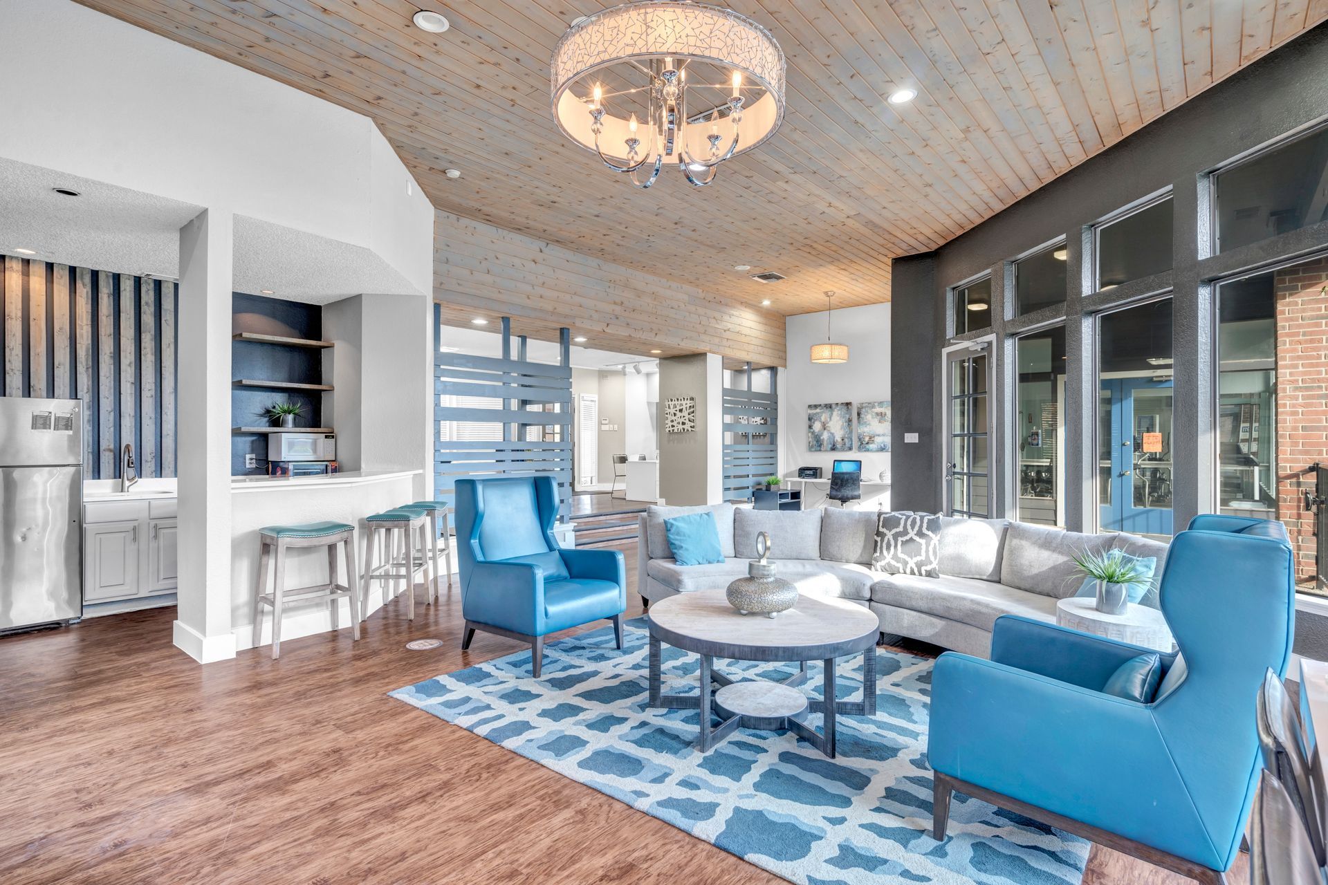 A living room filled with furniture and a chandelier.