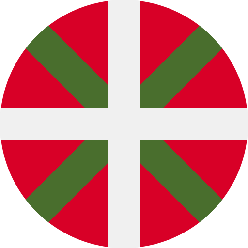 Drapeau basque circulaire, rouge avec croix blanche et bandes diagonales vertes.