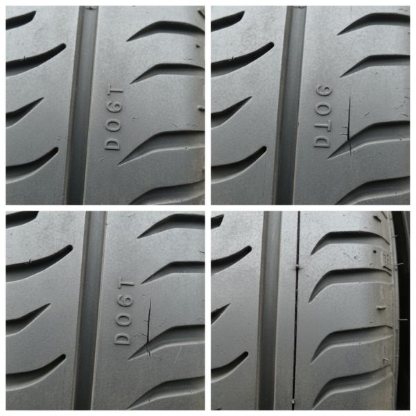 A tire's sidewall shows a clear DOT code for manufacturing date, with subtle signs of aging.