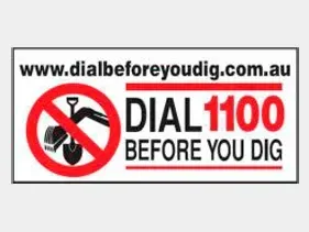 A sign that says dial 1100 before you dig. A sign that says dial 1100 before you dig.