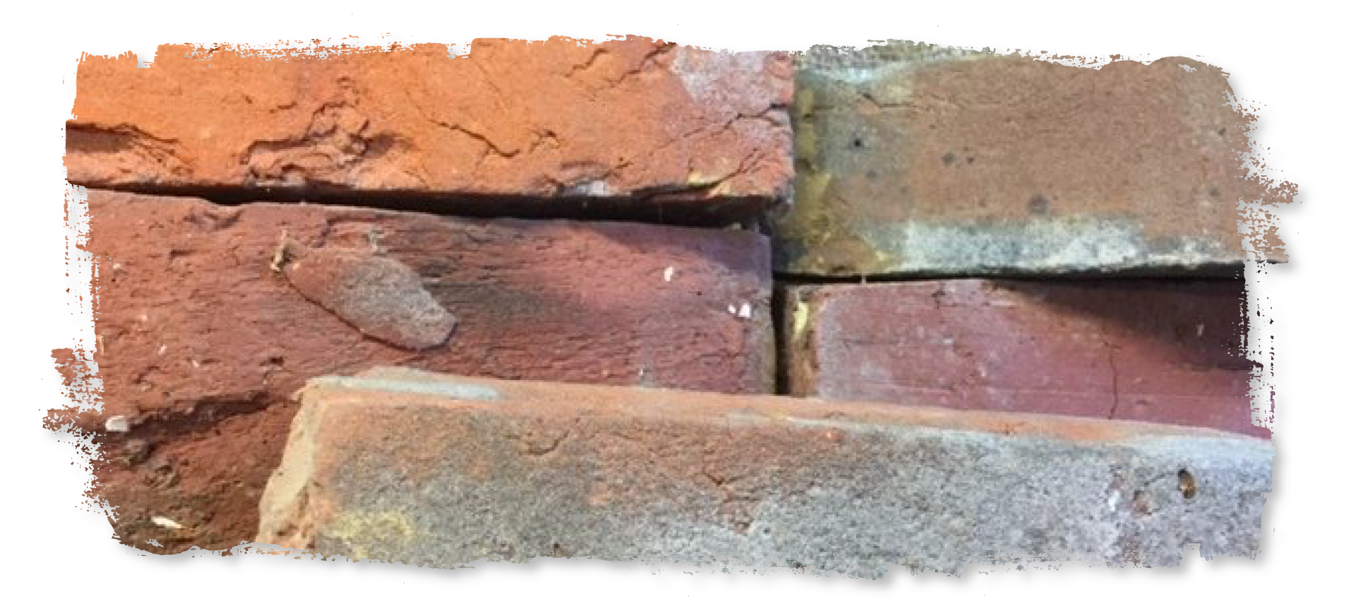 A bunch of bricks are stacked on top of each other on a white background.