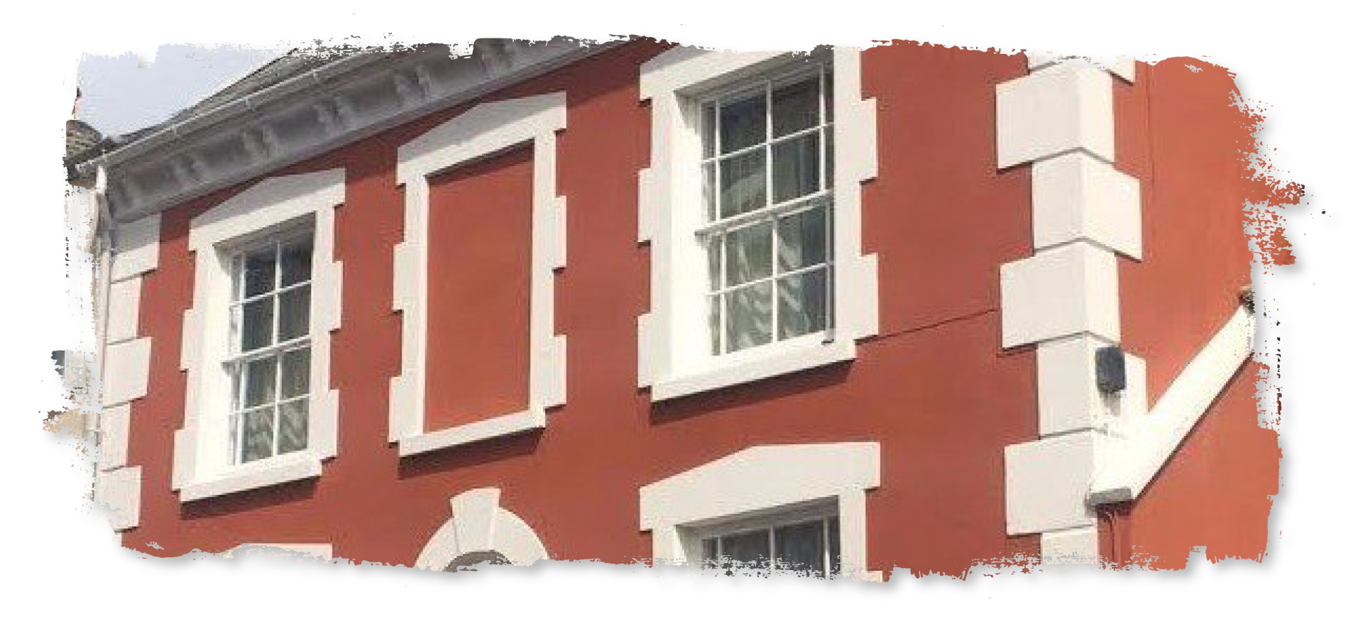 A red building with a lot of windows on it