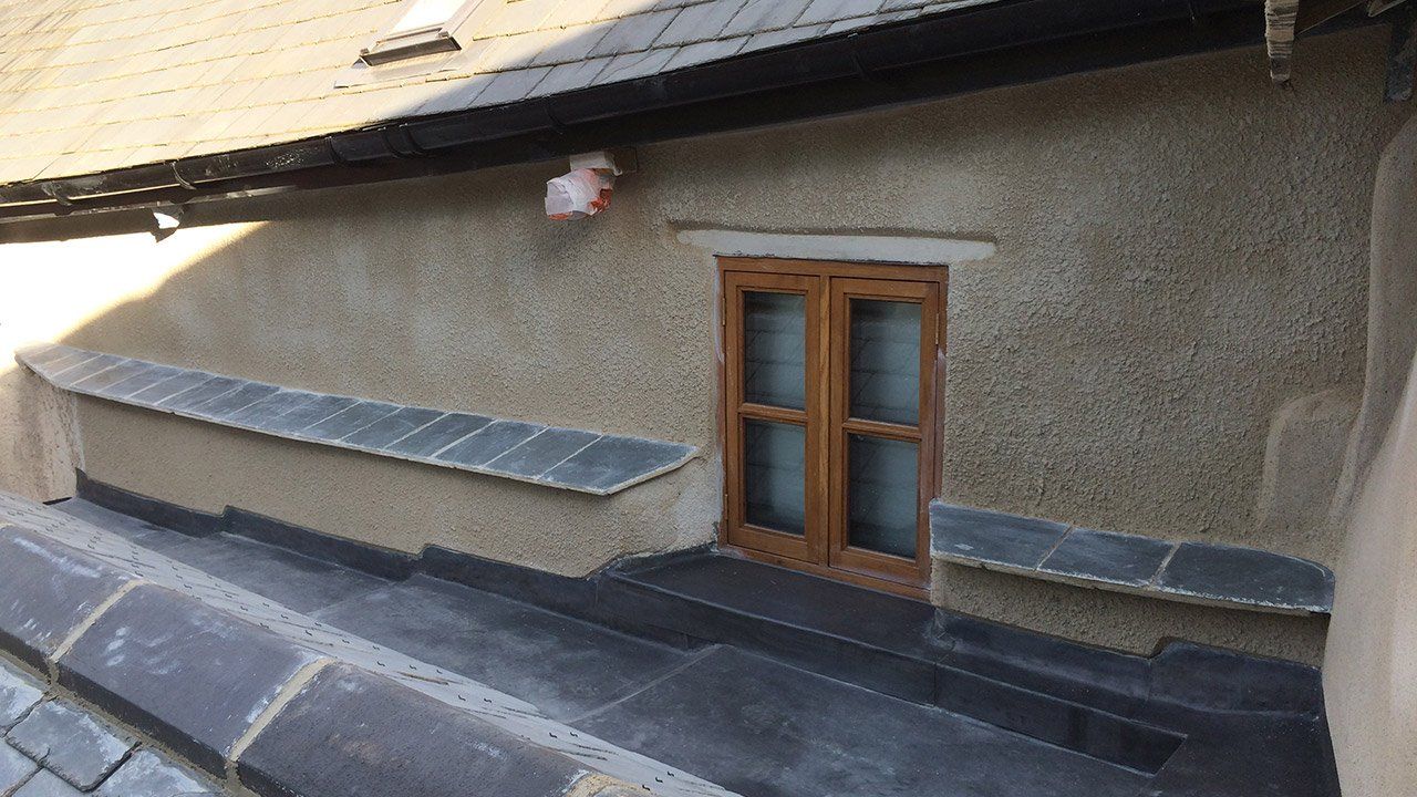 There is a window on the side of a building.