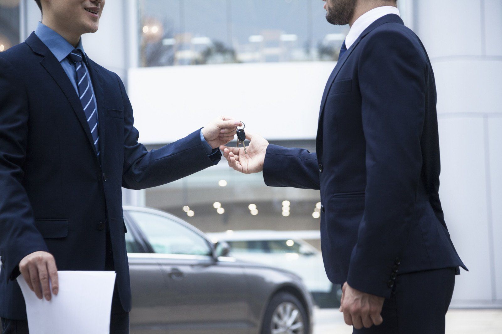 man handling the key to the customer