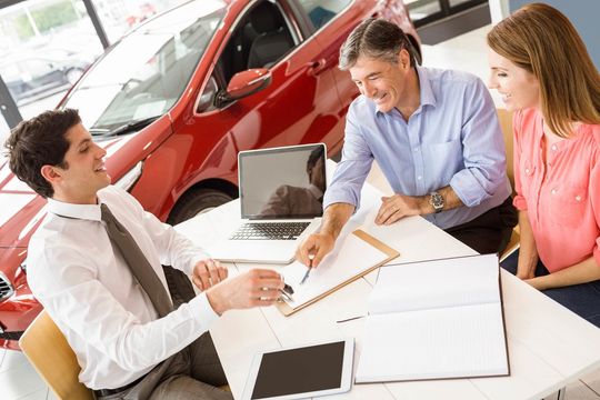 two customers talking to the man