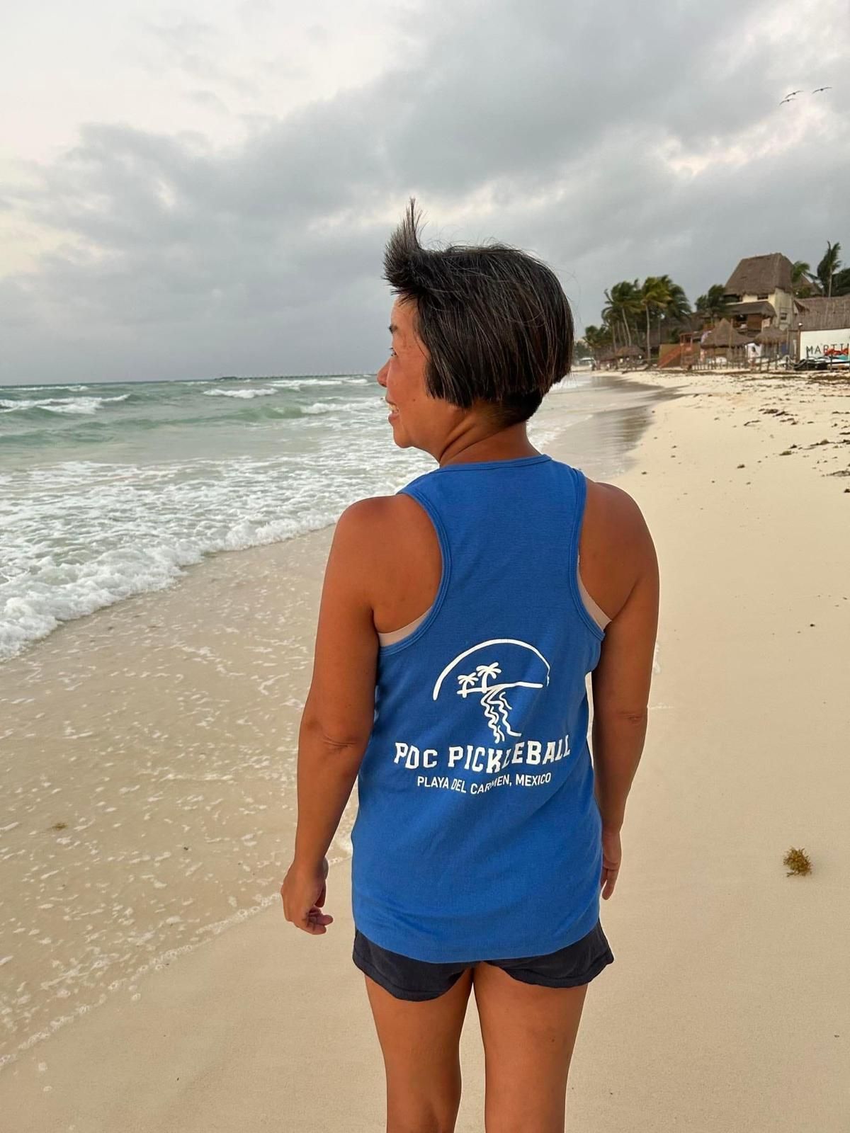 pickleball player taking a break at the beach in playa del carmne, md