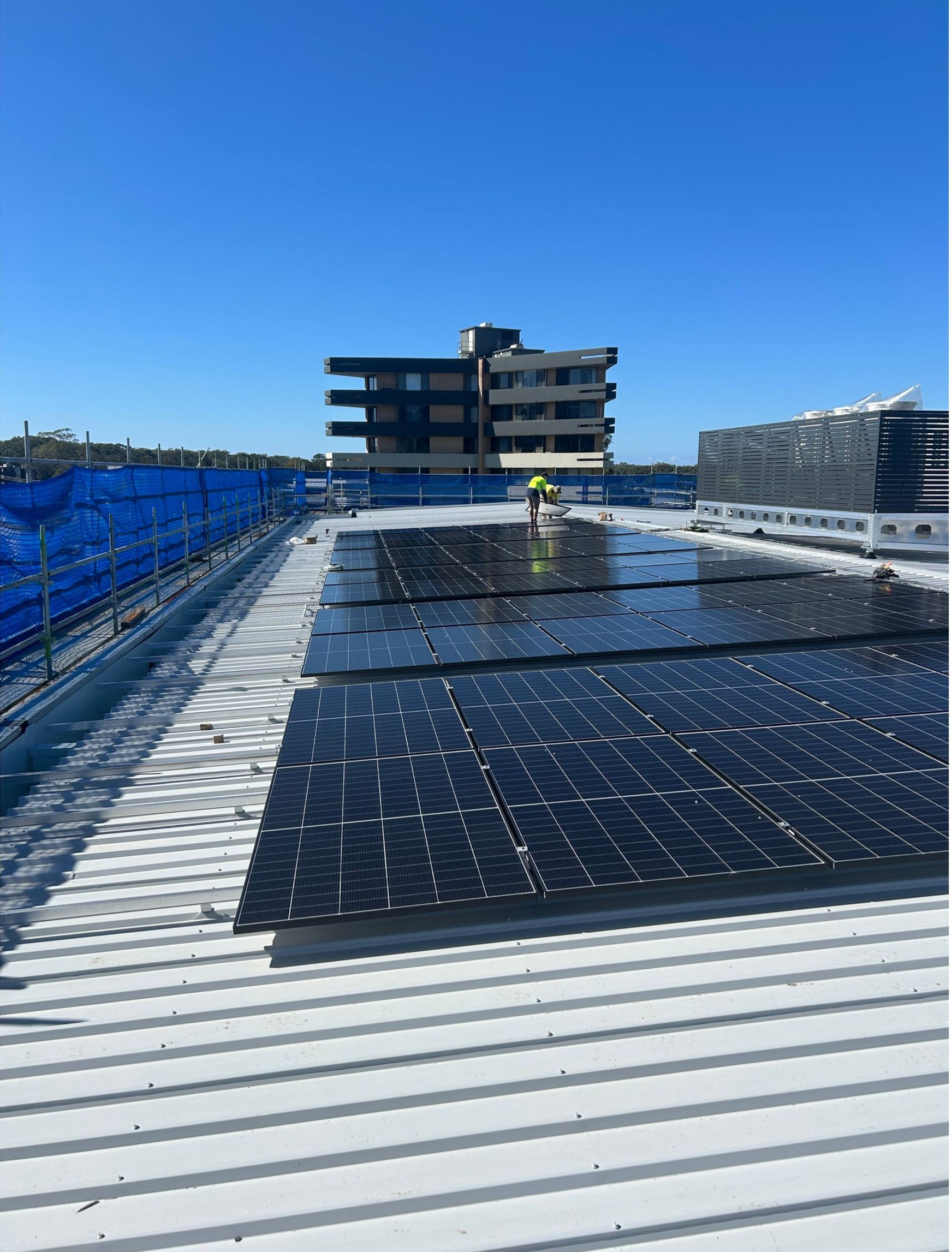 A House With a Lot of Solar Panels on the Roof — Ray Smith Electrical in Korora, NSW
