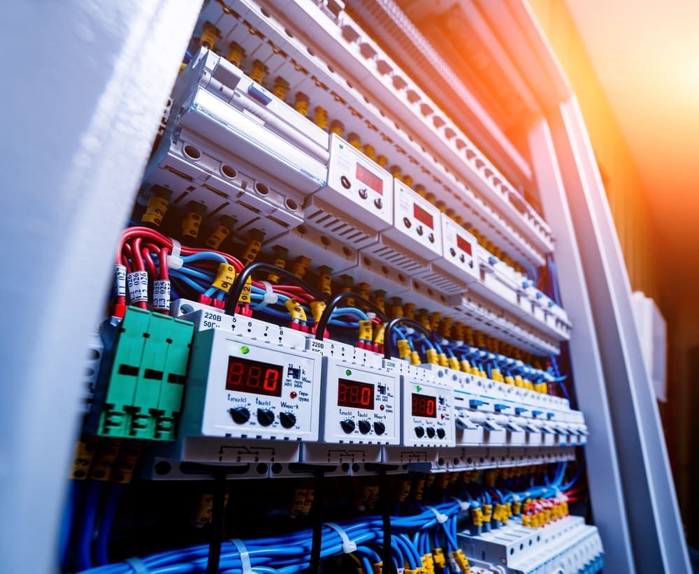 A Large Electrical Cabinet Filled With Lots of Wires and Electronics — Ray Smith Electrical in Korora, NSW