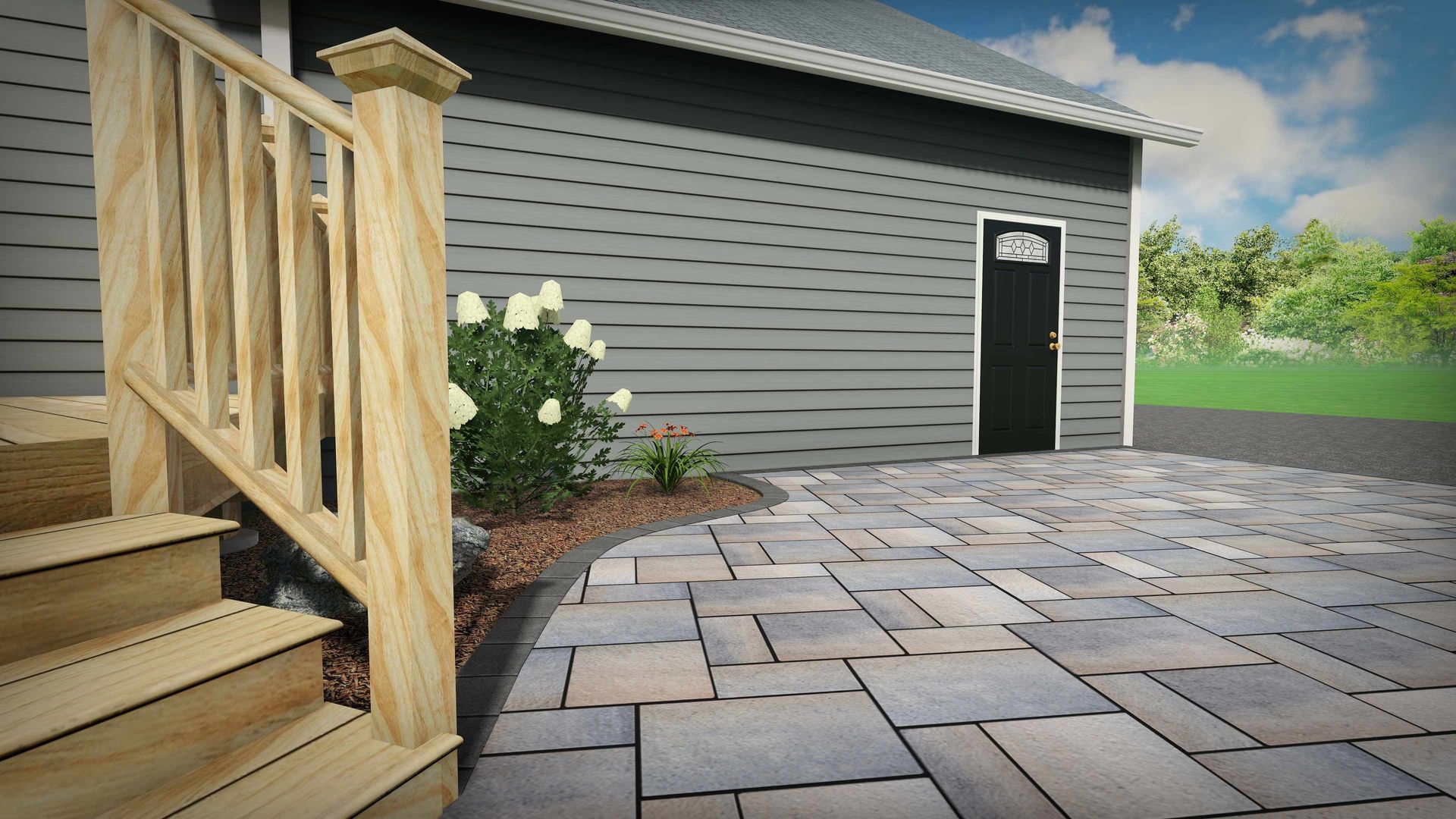A wooden staircase with a railing leads down to a patterned stone patio outside a grey-sided house with a black door.