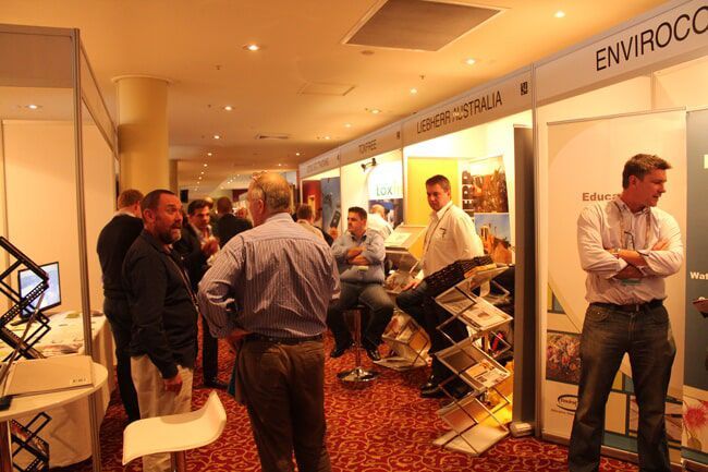 Conference Attendees Mingle Near Booths — Rme in Sapphire, NSW
