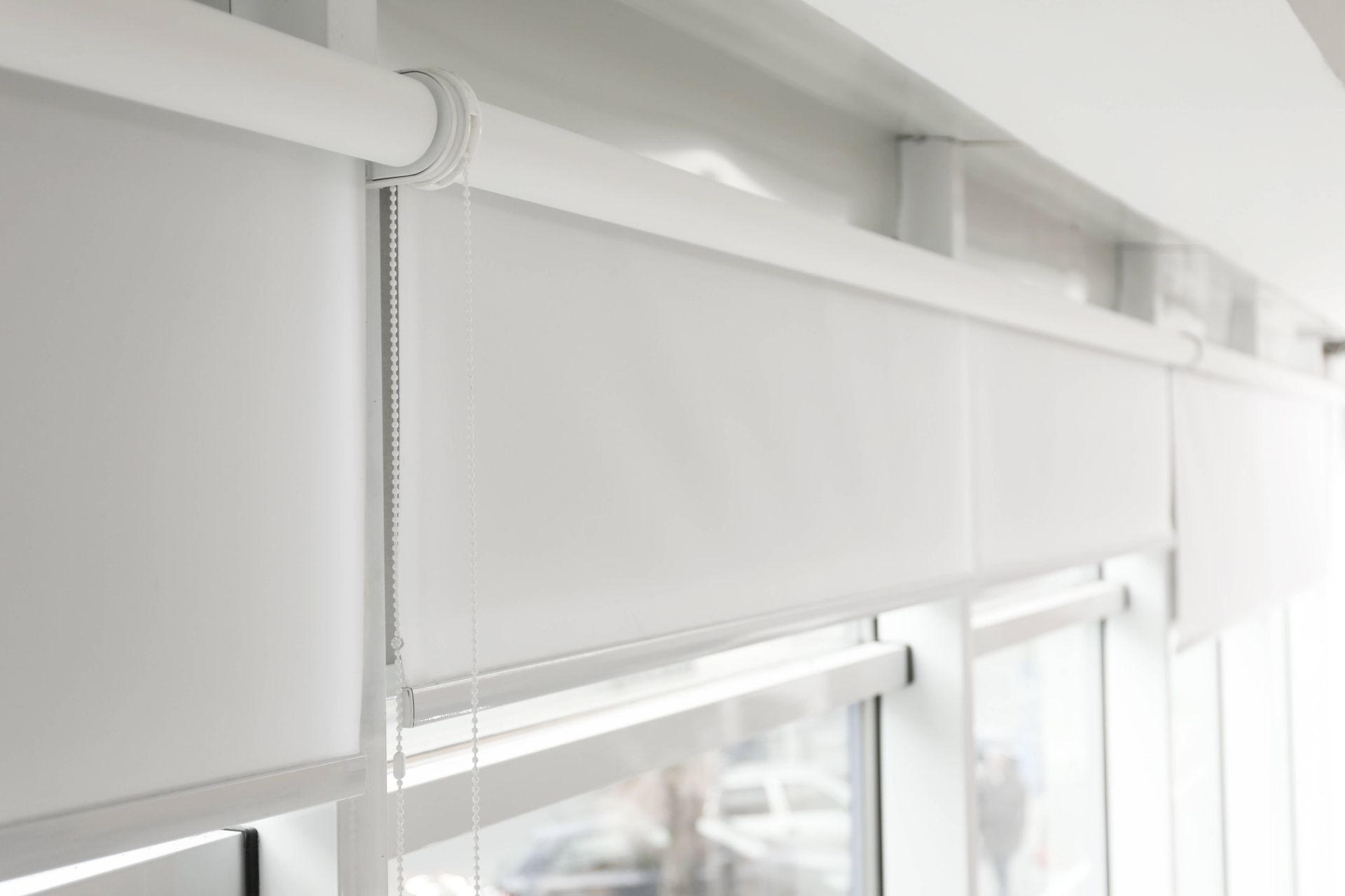 Dual roller shades hanging on three windows in a home near Toledo, OH