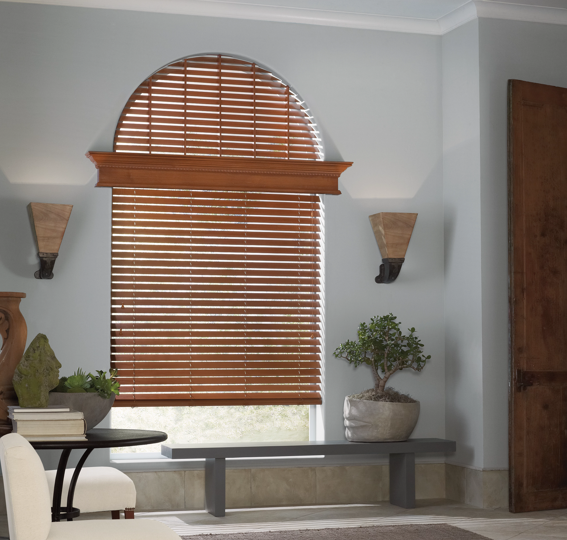 Hunter Douglas Parkland® Wood Blinds covering an arched window.