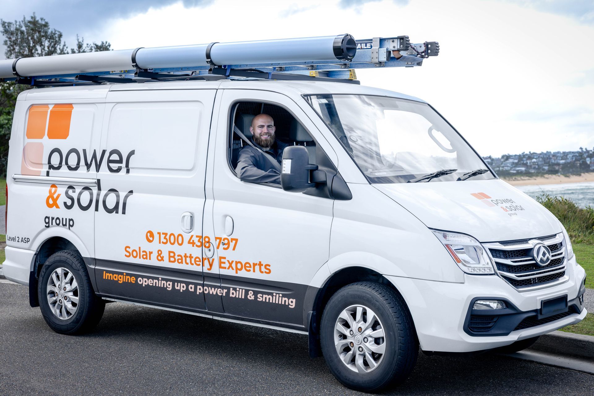 White power solar service van with roof-mounted panels and a driver inside, parked outdoors