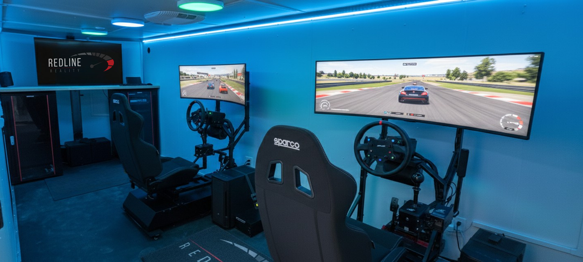 Blue-lit racing simulator room with steering wheel, monitor, and gaming chair facing a driving game