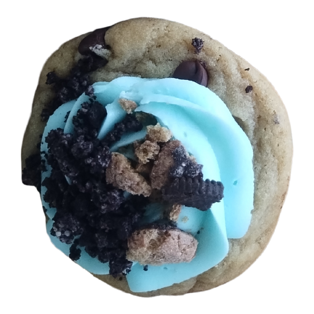 Cookie with blue frosting, crushed cookies, and chocolate chips.
