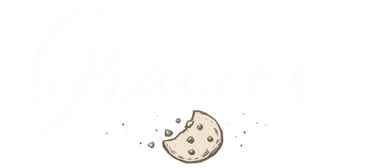 A cookie with a bite taken out, surrounded by crumbs, with the word 