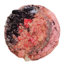 Pink cookie topped with Oreo, red crumble, and white icing.