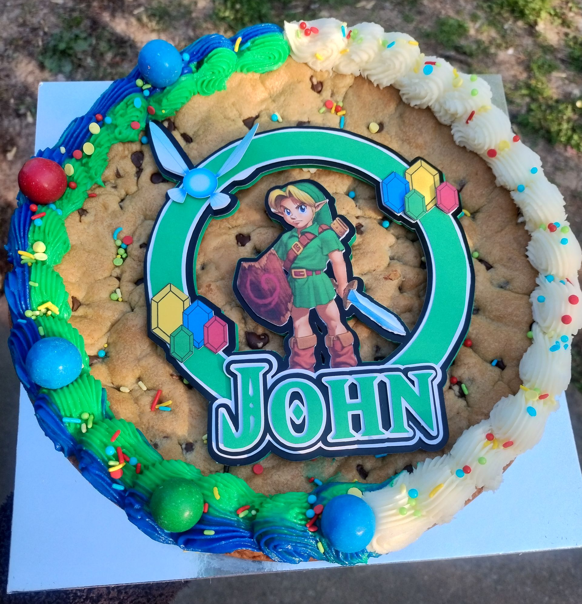 A Zelda-themed cookie cake with Link character, name 