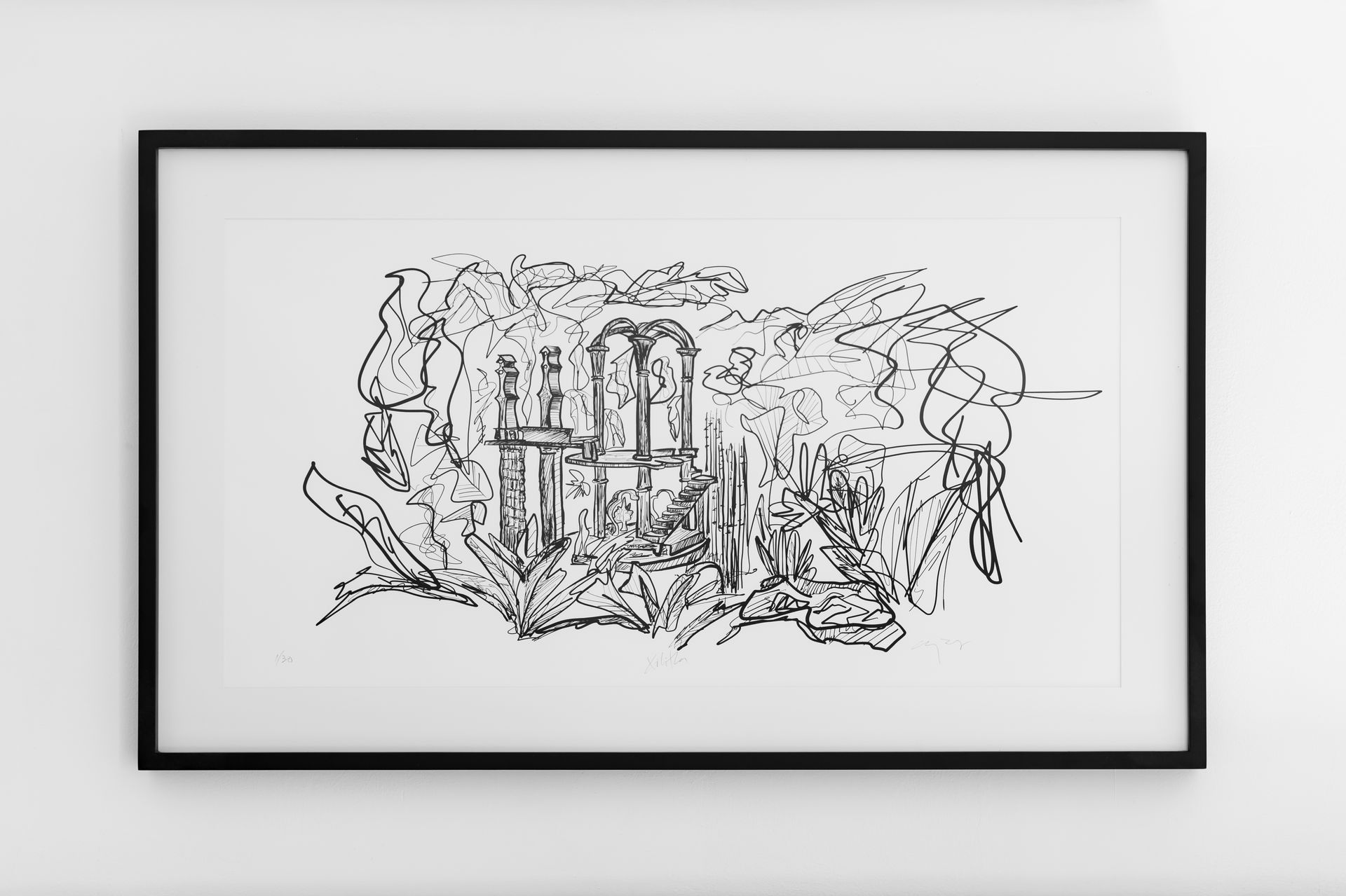 Un dibujo en blanco y negro de un cementerio está colgado en una pared blanca.