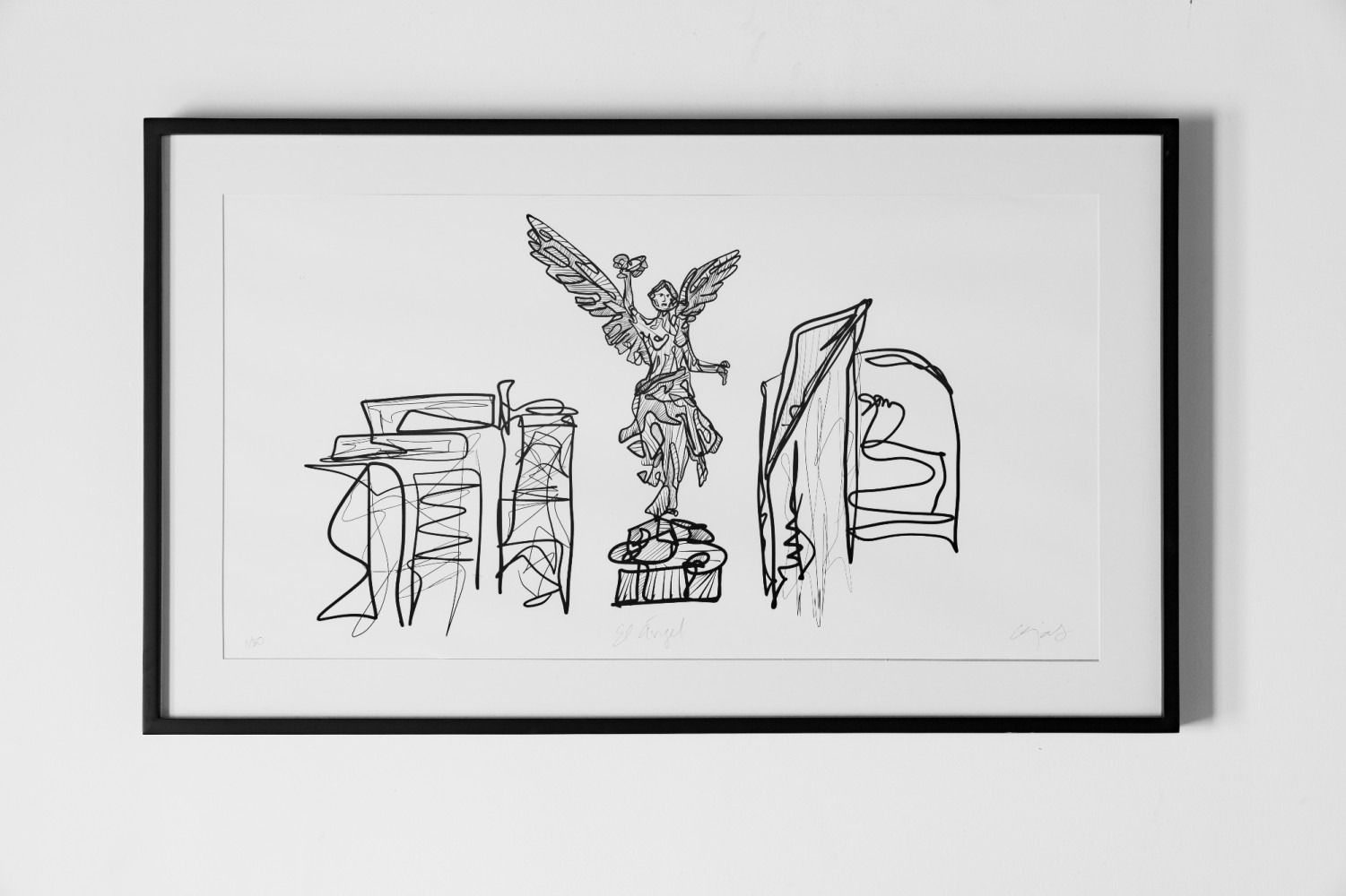 A black and white drawing is hanging on a white wall.