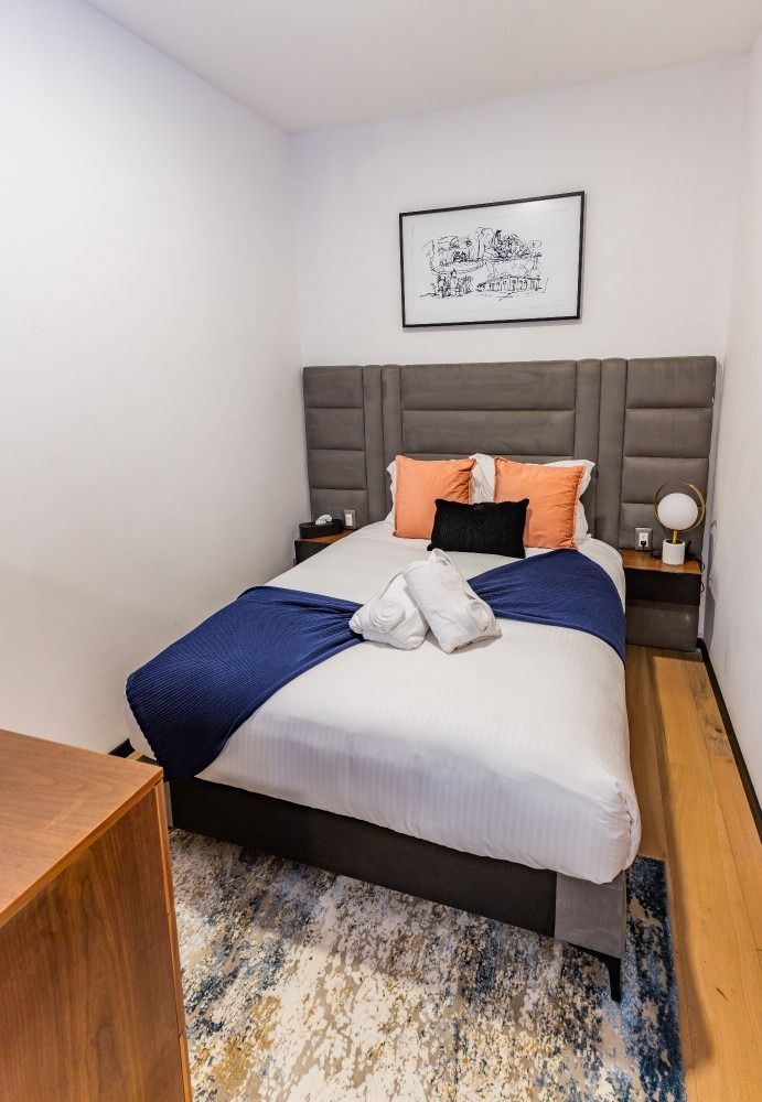 There is a large bed in the middle of the room.
